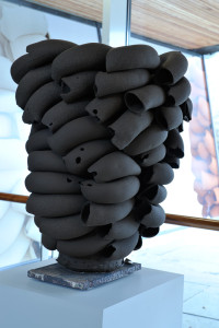 Black Stack 2013. Black earthenware clay, extruded pipe elements roughly modelled together in centre of stack round a wheel thrown bottom center cone, unglazed, sandblasted when dry, electric fired. H 80 cm. Private collection. Photo: Jørn Hagen